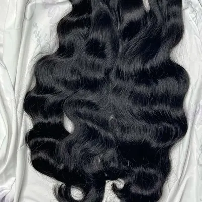 This is the standard of quality we work with: 100% real human hair. In my training, you will learn to assess the quality of hair wefts, ensuring you always provide a premium, natural-looking product for your clients.