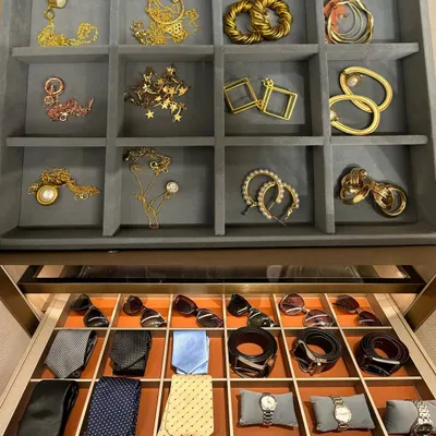 Luxury is in the details. This image shows how we create dedicated, elegant storage for both men's and women's accessories, from jewelry and earrings to ties and watches.
