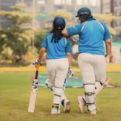 Starting their lifelong partnership on the cricket pitch. This shot captures the couple walking off the field together, a perfect metaphor for their journey ahead.