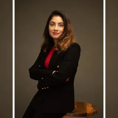 I guide my clients into poses that feel and look confident. This classic crossed-arm portrait against a dark studio background is perfect for a powerful LinkedIn profile picture or a corporate website bio.