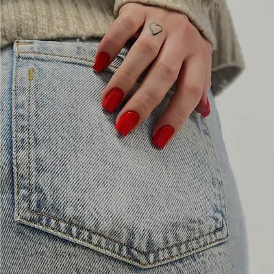 A classic, vibrant red on a short, natural nail shape. It's a timeless look that never fails.
