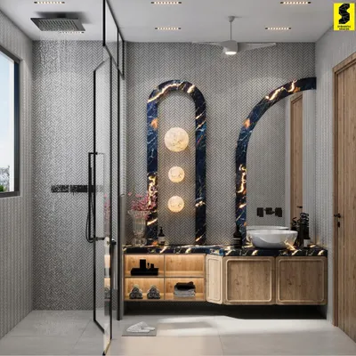 This washroom blends calm tones with striking details. A deep blue backlit marble panel serves as a bold visual anchor, while warm wooden cabinetry and chevron tiles create a serene, elegant experience.