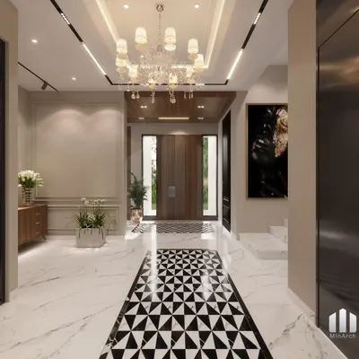 A perfect entrance sets the perfect tone. This long hallway uses a bold geometric marble inlay to guide the eye towards the main door, while a grand chandelier adds a touch of classic opulence.