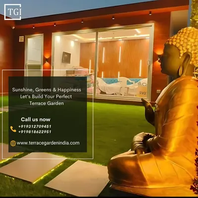 A beautiful evening shot of a completed terrace featuring a golden Buddha statue overlooking the garden, creating a space of pure sunshine, greens, and happiness.