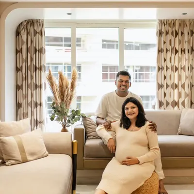 A beautiful family portrait right in their living room. At-home sessions are so special because they capture you in your own environment. This couple looks so relaxed and happy in their beautifully decorated space.