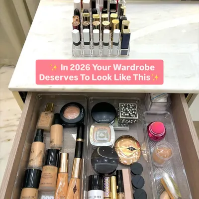 A makeup lover's dream drawer. We use clear, modular organizers to separate products by category: foundations, powders, palettes, and creams. On the countertop, a lipstick holder keeps every shade on display.