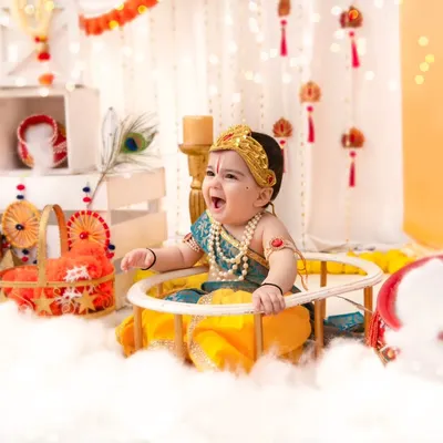 A joyful 'Little Kanha' laughing with delight. I focus on capturing genuine expressions, even in highly stylized and themed shoots like this one.