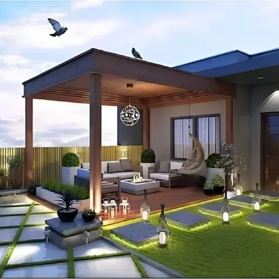 A complete rooftop transformation featuring a wooden pergola with a lounge area, a fire pit, and a green lawn space. The integrated pathway lighting creates a magical ambiance for evening gatherings under the stars.