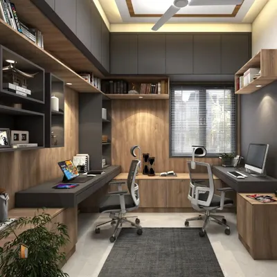 A dedicated home office designed for two people. The space features dual workstations, ergonomic chairs, and extensive overhead and side storage, ensuring a productive and organized work environment.
