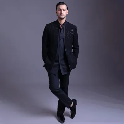 An open designer bandhgala paired with a kurta. This look is the epitome of minimal, elegant, and timeless style, offering a versatile option for any semi-formal or celebratory occasion.