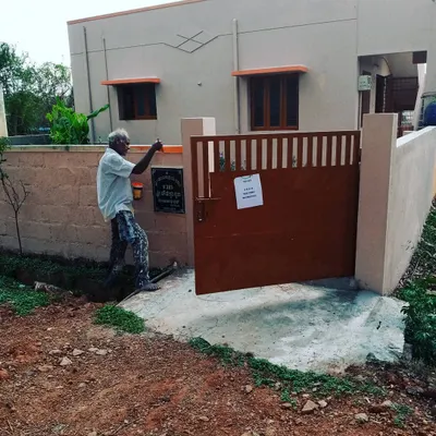 Here I am applying the final touches to a freshly painted metal gate. A proper paint job on exterior metal is essential for preventing rust and keeping your entrance looking sharp.