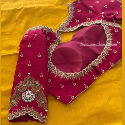 A complete view of a magenta bridal blouse featuring my signature jewellery concept. The neckline and sleeves are heavily embellished with kemp and zardosi work, designed to resemble a royal choker and armlets.