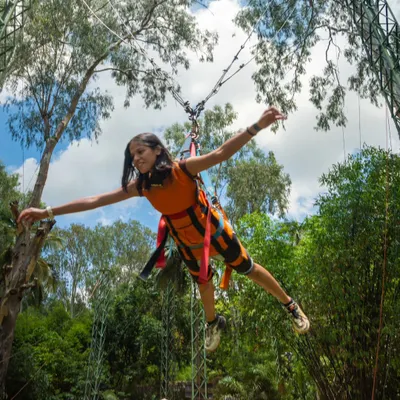 This is the Superman Swing. You're harnessed in face-first, so you literally feel like you're flying over the trees. It's an unforgettable experience for any thrill-seeker.