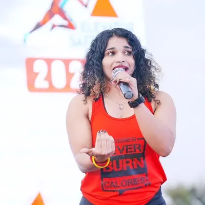 Leading the crowd with energy and passion. In my dance fitness sessions, I make sure everyone feels the beat and has a great time while getting a fantastic workout.