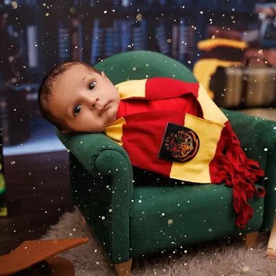 A close-up of our little wizard, looking right at the camera in his magical Harry Potter setup. The details make the theme come alive.