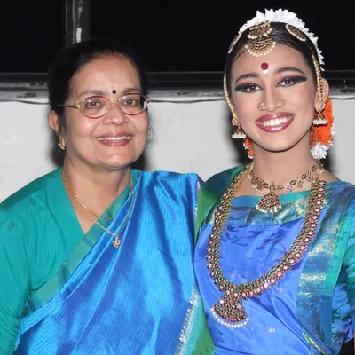 A cherished photo with my Ammany on her birthday. My family's support has been an endless source of strength and inspiration throughout my artistic journey.