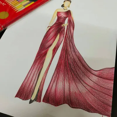 A beautifully rendered fashion illustration of a flowing red evening gown with a high slit. Our students learn to use colored pencils and other mediums to depict fabric drape, texture, and movement, a crucial skill for presenting design concepts.