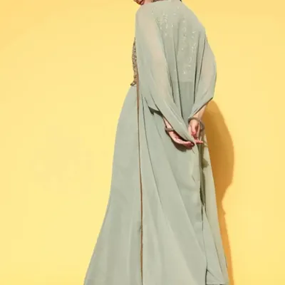 The back view of the sage green co-ord set. This angle shows the long, flowing georgette shrug that adds a layer of elegance and movement to the outfit.