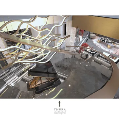 An aerial view of a custom chandelier that flows like a river of light above the staircase. This piece was designed to be beautiful from every angle, whether viewed from above, below, or the side.