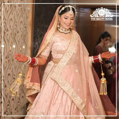 This bride is a vision in her pastel pink lehenga. I created a fresh, dewy makeup look with soft pink tones and a subtle shimmer to give her an ethereal glow.