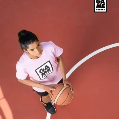 Aim higher. An overhead shot of a player ready to make her next move. Our courts are where you can focus on your vision and elevate your game.