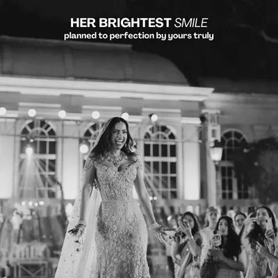 Her brightest smile, planned to perfection. This black and white shot captures the pure, uninhibited joy of a bride on her special day, a moment of happiness that we work tirelessly to create.