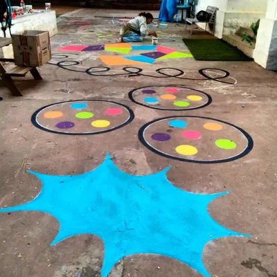 A wide view of the 45-foot epic battle-course floor mural I painted for Papagoya Micro School in Bangalore. This isn't just decoration; it's a functional art piece for play and fitness.
