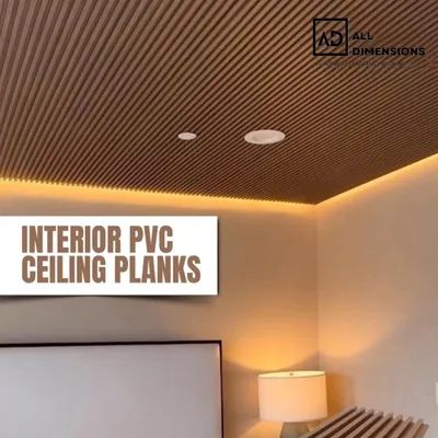 A bedroom ceiling featuring brown interior PVC planks with integrated cove lighting. This design adds a warm, cozy, and modern finish to the room, making the ceiling a key feature.