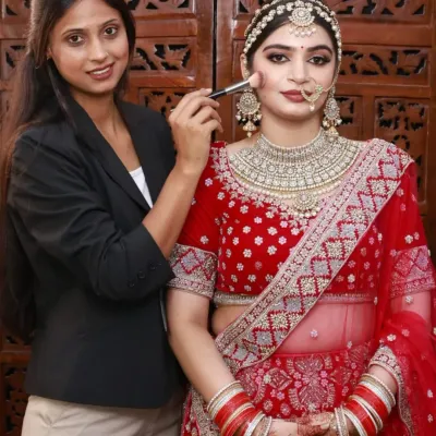 I'm so proud of the work my students produce. Here is a student from my academy applying makeup on a model, creating a flawless bridal base.