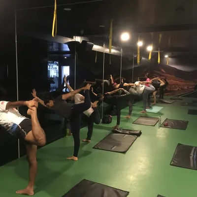 A group of students finding their balance in Natarajasana (Lord of the Dance Pose). In my classes, we work together to improve concentration and stability, one pose at a time.