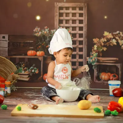 Our 'Little Master Chef' theme is all about playful fun. Here, our tiny chef is busy mixing ingredients, creating adorable and messy memories in a rustic kitchen setup.