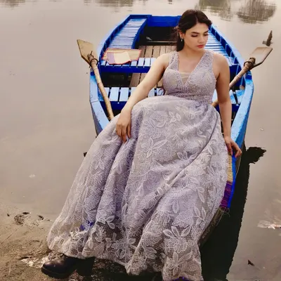This beautiful grey gown with delicate floral lace embroidery was styled for a serene concept shoot on the water. The full skirt creates a lovely, soft silhouette.