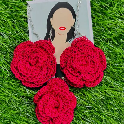 My classic red rose crochet jewelry set, featuring a floral pendant necklace and matching earrings. Each piece is carefully handcrafted from soft cotton thread, offering a bold and romantic look.