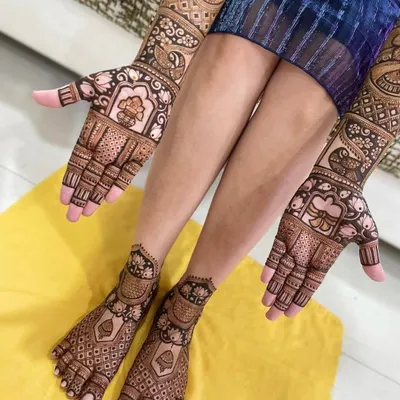 This is a perfect example of a full bridal mehandi set. The intricate designs on the hands and feet complement each other beautifully, creating a complete and stunning look.