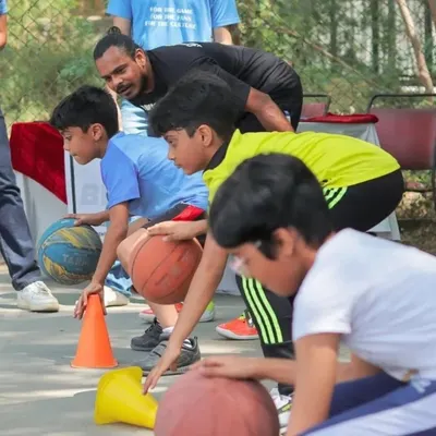 Find your passion, whatever it may be. Here I am working with a group of young hoopers, teaching them the basics of dribbling in a fun, engaging way.