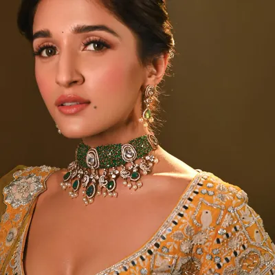 A close-up of the makeup I did for the stunning Nidhi Shah. I created a fresh, sun-kissed look with a focus on glowing skin and a soft pink lip to complement her emerald choker.