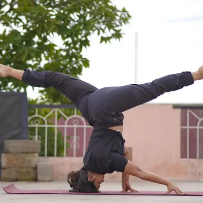 Playing with a split in a headstand. Once you're comfortable with the basics of an inversion, we can explore fun and challenging variations like this to build more core control.