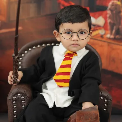 Our little Harry Potter, complete with a Gryffindor tie and wand. This is one of our most requested themed shoots for toddlers.