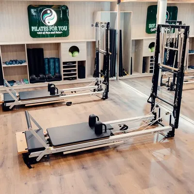 A look at our fully equipped studio. With multiple reformers, Cadillac towers, and stability chairs, I have everything needed to provide a comprehensive and varied Pilates experience.