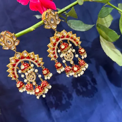 Introducing our exclusive traditional jewellery. These stunning red and white meenakari chandbalis with jhumkas speak of royalty in every detail.