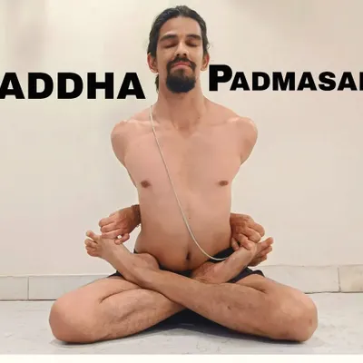 Baddha Padmasana, or Bound Lotus Pose. This advanced posture opens the shoulders and hips, requiring significant flexibility.