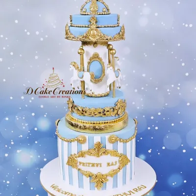 A magnificent carousel cake to celebrate one month of baby Prithviraj. This three-tier creation in blue, white, and gold is a dreamy centerpiece for a first milestone.