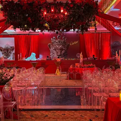 For a prestigious event with Cartier, I drenched the venue in the brand's iconic red. The theme was carried through every detail, from the red floral chandeliers to the leopard-print motifs, creating an atmosphere of pure, unapologetic luxury.