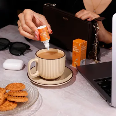 This lifestyle photo shows Sprig's Chai Masala Extract in a natural, everyday work setting. My goal here is to place the product directly into the customer's life, making it feel both aspirational and essential for their daily routine.