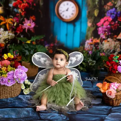 This little fairy is ready to spread her magic. Dressed in a green tulle outfit with delicate wings, she looks right at home in my enchanted garden setup.