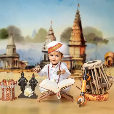 A complete Varkari setup with your little one dressed as a pilgrim, surrounded by idols, a tabla, a veena, and a holy book. The Pandharpur temple backdrop completes the scene.