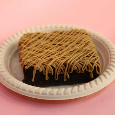 Our new Lotus Biscoff Brownie. A rich, fudgy brownie base topped with a generous drizzle of creamy Biscoff spread.