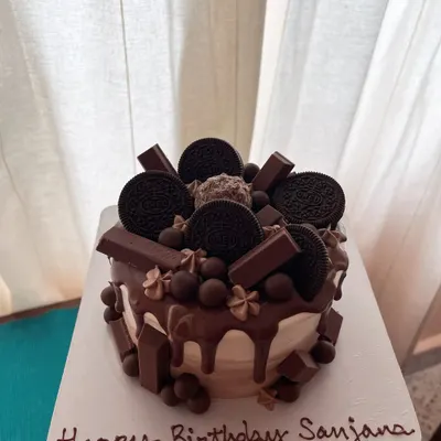 The ultimate chocolate overload cake. This 5-inch chocolate sponge is covered in dark chocolate ganache and loaded with Oreos, KitKats, and other chocolate treats.