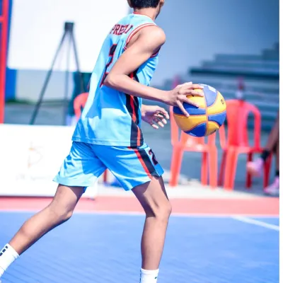 A young player dribbling with precision during a Junior Basketball League game. I focus on creating opportunities for young athletes to showcase their fundamental skills.
