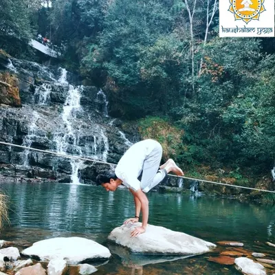 Here, I practice Bakasana, the Crane Pose, on a rock amidst a flowing waterfall. This arm-balancing asana requires immense focus and core strength, teaching us to find stillness and stability even when surrounded by constant movement.